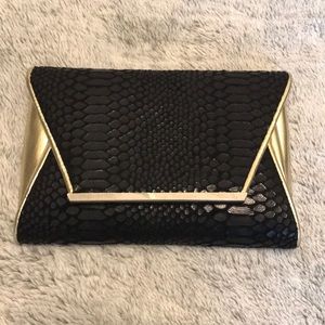 Black faux snakeskin detail Clutch with gold